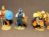 seven figurines of different types of people dressed in medieval clothing