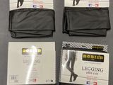four pairs of legging tights are on display on a table