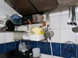 a picture of a kitchen with blue and white tiles