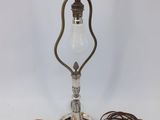 an old fashioned lamp with a cord attached to it