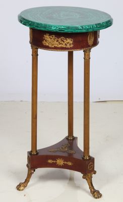 an image of a small table with a green top on a white floor