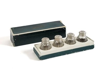 three salt and pepper shakers in a box