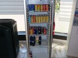 an image of a refrigerator with drinks and sodas in it