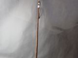a close up of a wooden stick on a white background