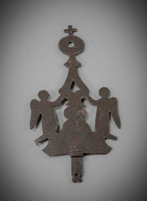 a metal christmas tree with angels and a star on it
