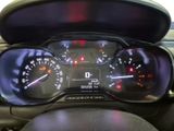 a close up of a car dashboard with a speedometer and gauges