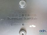 a close up of a metal plate with a button on it