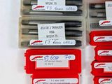 a lot of different types of screws in a box