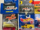 several hot wheels cars are lined up on a table