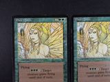 these are two cards from a card game with a picture of a woman and a man