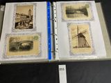 an open book with pictures of a windmill and other buildings