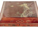 a wooden box with a painting on it