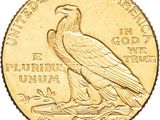 a close up of a gold coin with an eagle on it