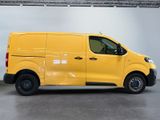 the yellow van is parked in the garage with its door open