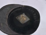a black hat that has a picture of a man on it
