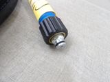 a hose that is sitting on the floor next to a tire