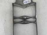 an old metal chair with a tag on the back of it