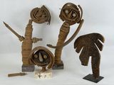 three wooden sculptures of different shapes and sizes on a table