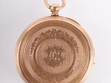 an image of a gold pocket watch on a white background