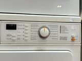 a white washer and dryer sitting next to each other