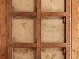 a window with a wooden frame on the wall