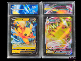 two pokemon cards are in a clear plastic case on a black background