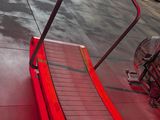 a red tread on the floor in a gym