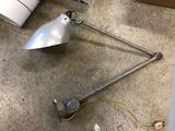 a lamp that is sitting on the floor next to a lamp