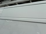 an image of a white van parked in a garage
