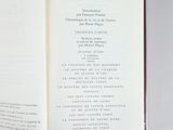someone is holding a book open to a page with a list on it