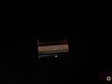 a small box that is sitting in the dark