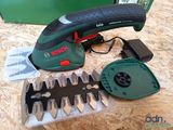 a cordless electric tool that is sitting on a table