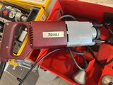 a red box that has a drill and other tools in it