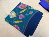 two pieces of fabric that are on a table