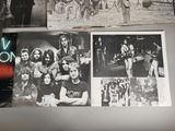 several black and white photos of a group of people on a wall