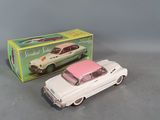 two toy cars are sitting next to each other on a table