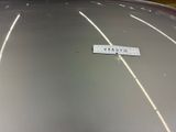 a sticker on the hood of a silver car