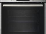 a close up of a stainless steel oven with the door open