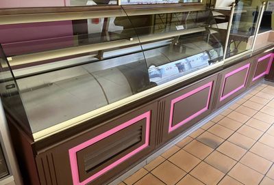 a refrigerated display case in the middle of a store