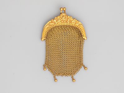 a gold mesh purse with a chain around it