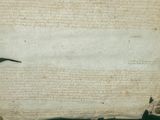 an old paper with a black bird on it sitting on top of a piece of paper