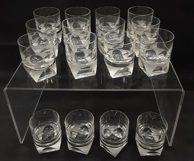 a lot of glasses that are sitting on a table