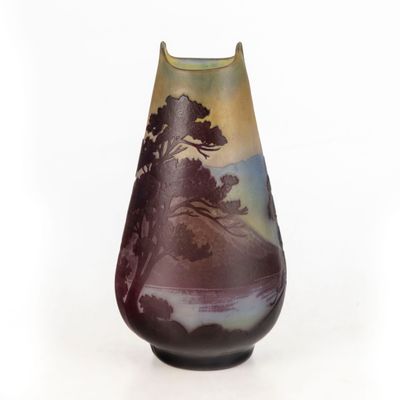 a vase that has a picture of a tree on it