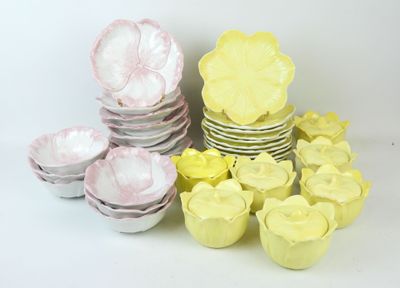 a lot of plates and cups on the table