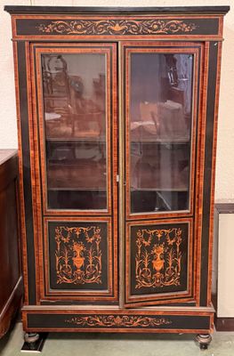 an image of a cabinet with a glass door in a room
