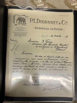 an old document with writing on it sitting on top of a table