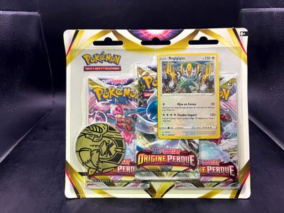 a close up of a box of pokemon cards on a black surface