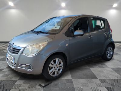 a picture of a silver car parked in a garage