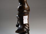 an image of a sculpture of a person holding a dog