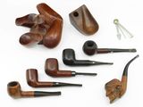 a lot of different types of pipes on the table